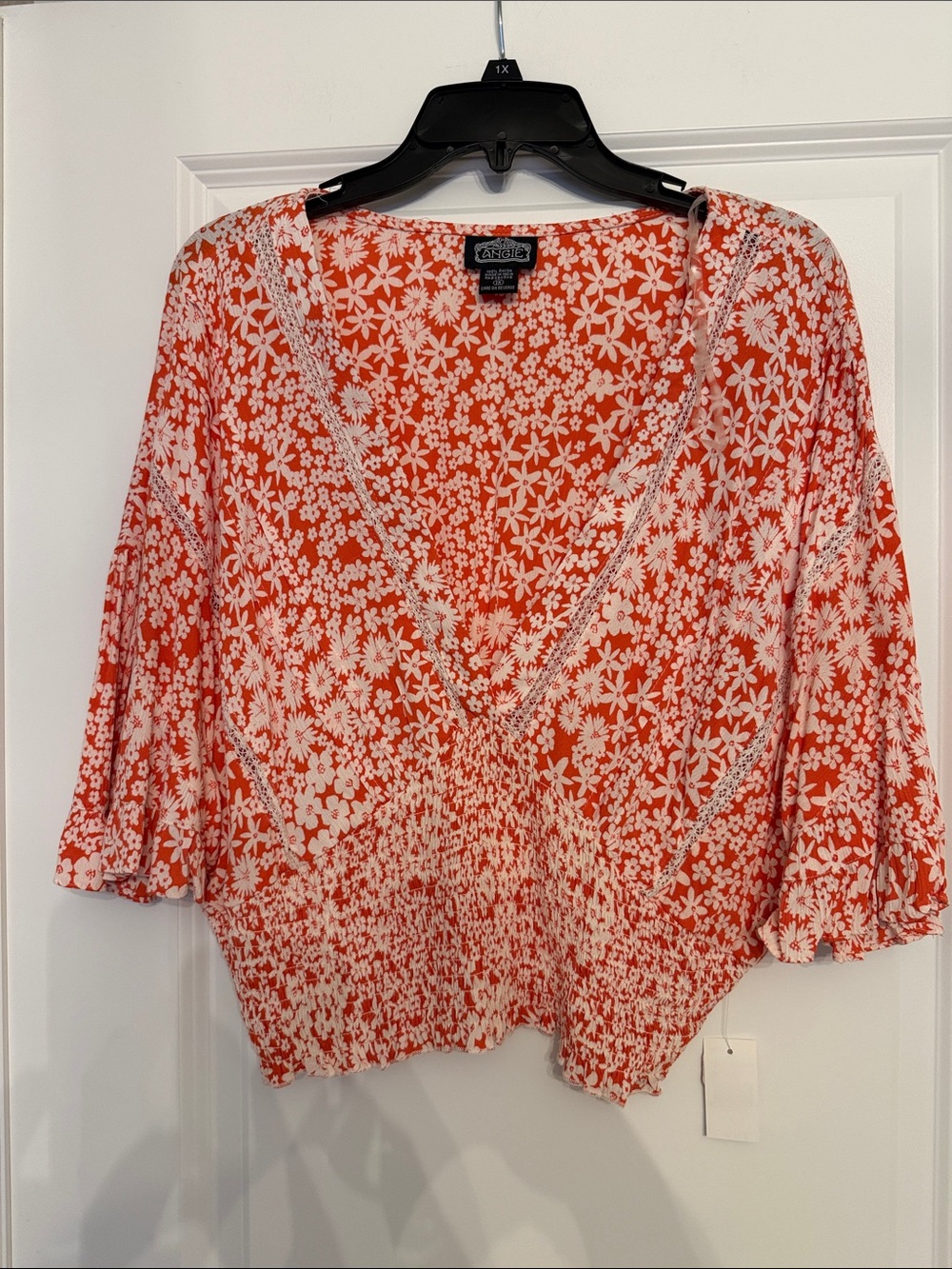 Angie orange and white top in an outstanding print